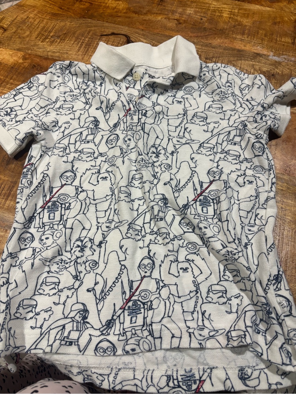 GAP White Polo with Navy Character Line Art and Red Accents